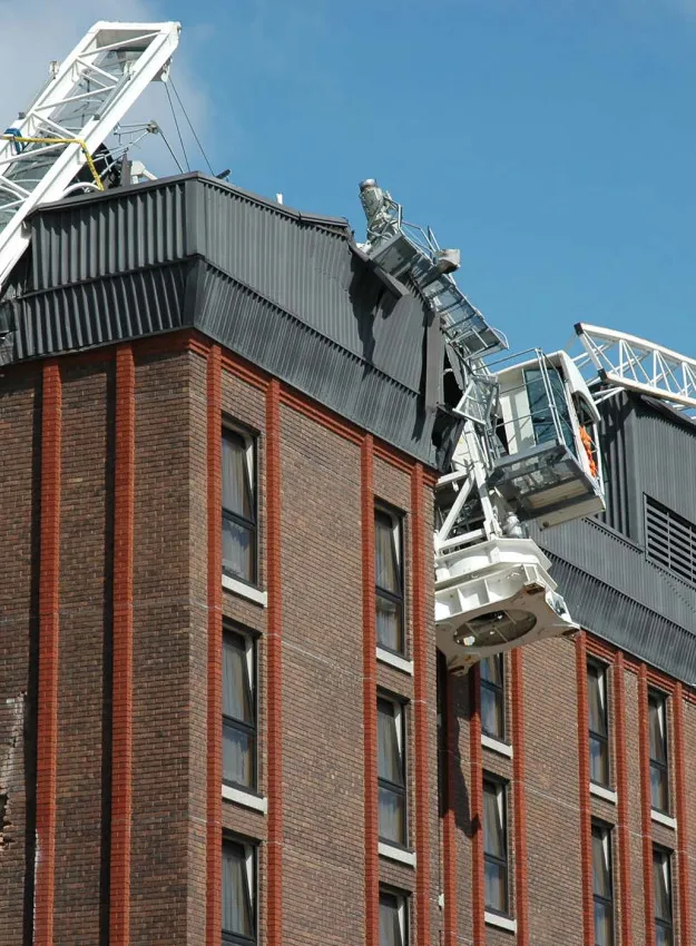 Construction Crane Collapsed on Top of a Building