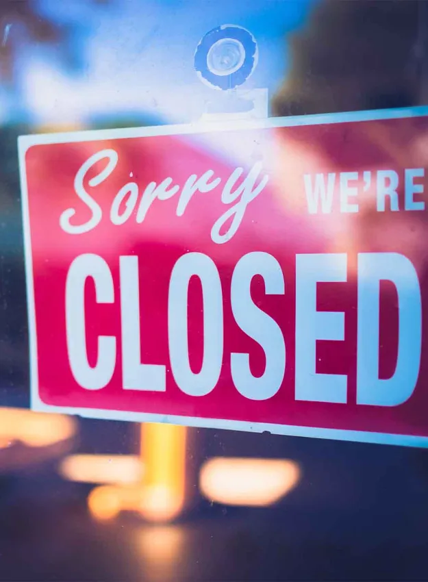 Closed Sign on Business Door