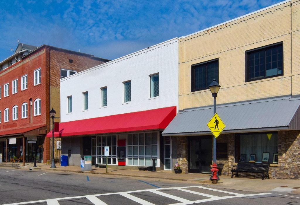 A Row of Commercial Buildings Next to a Road