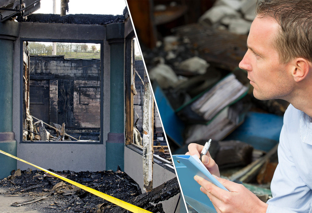 Male Insurance Adjuster Inspecting a Burned Out Building 